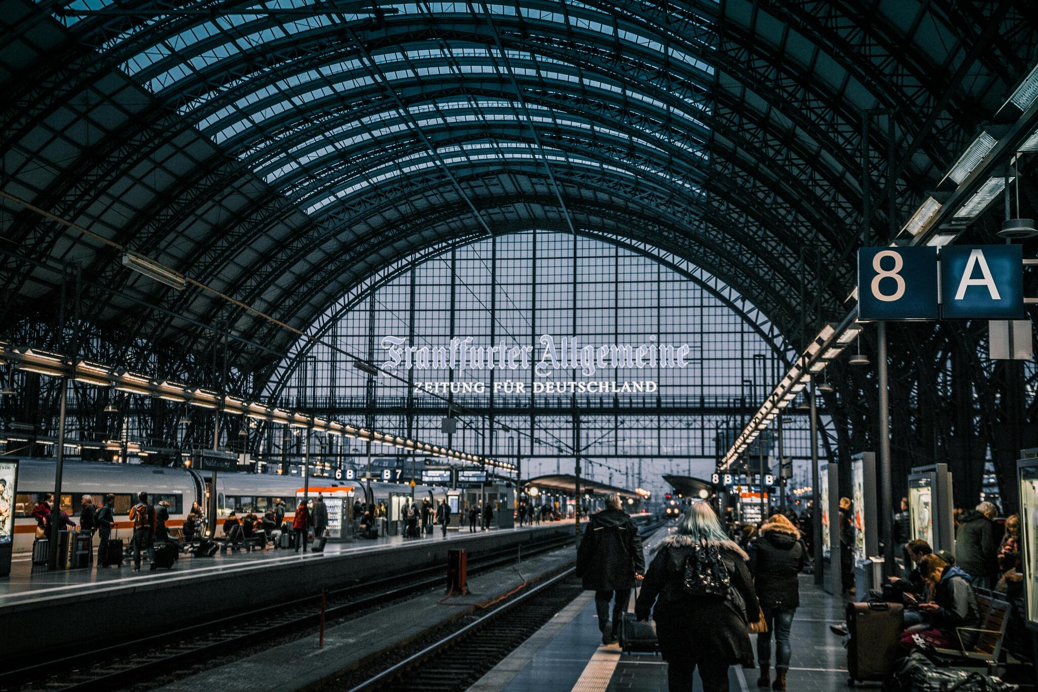 Inside Frankfurt Hauptbahnhof, with trains at the platforms under the station roof